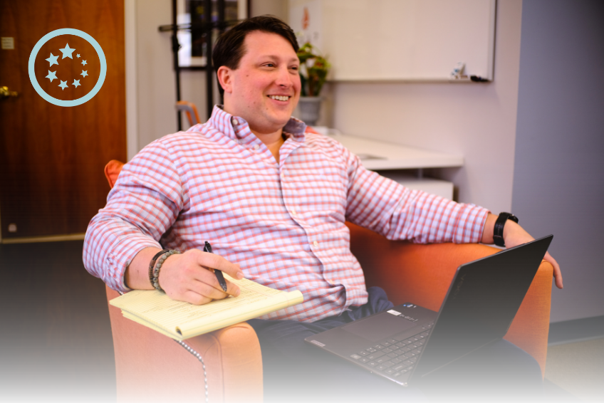 man sitting with laptop